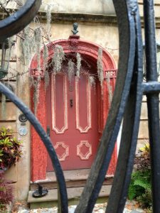 A glimpse through the fence at a historic Charleston home